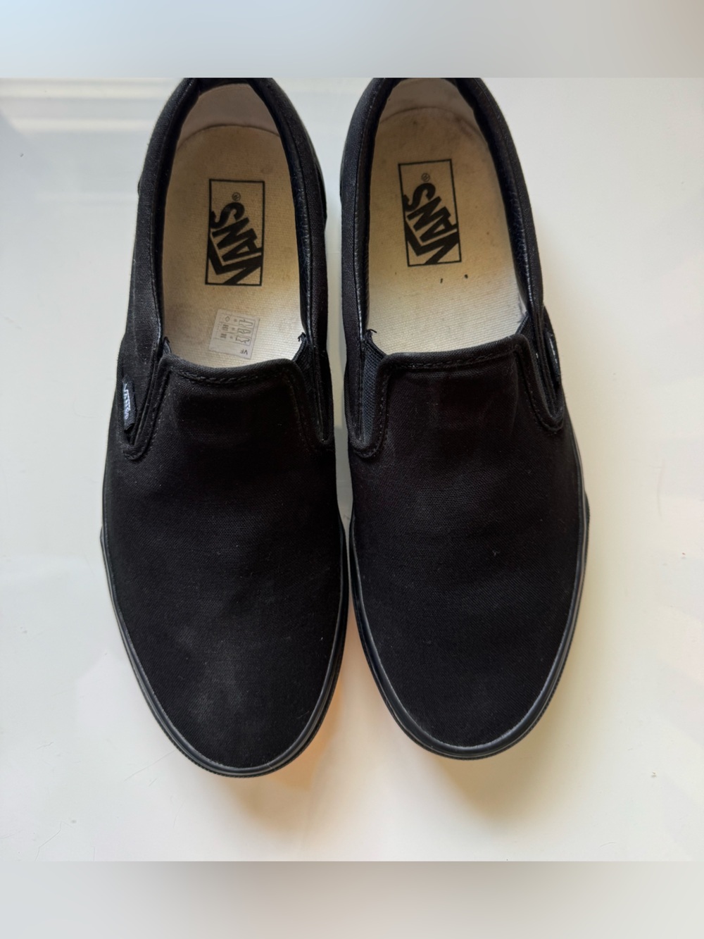 Size 11 (W); Size 10 (M) Black Vans Canvas Slip-On Canvas Shoes